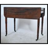 An early 19th century Georgian Pembroke table rais