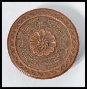 A 19th century wooden needle box of circular form