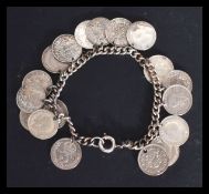 A sterling silver / 925 charm bracelet having eigh