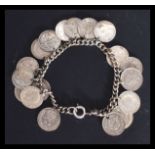 A sterling silver / 925 charm bracelet having eigh