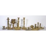 A good collection of brass chamber sticks and cand