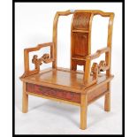 A 20th century Chinese hardwood low zen type chair