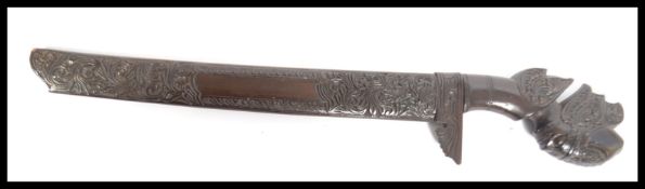A vintage 20th century carved hardwood short sword