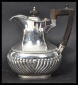 A Victorian silver hallmarked hot water jug of ova