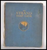 A Strand stamp album with strong collection of sta