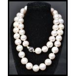 A fine quality cultured pearl necklace having an 1