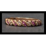A hallmarked 9ct gold ruby and diamond band ring h