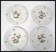 A group of four Herend porcelain cabinet plates ha