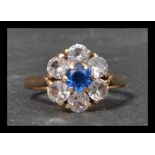 A 9ct gold cluster ring set with a central round b