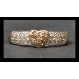 A hallmarked 9ct gold and diamond band ring having