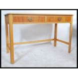 A contemporary 20th Century console table, two dra