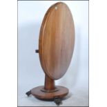 A 19th century Georgian mahogany tilt top dining t