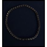 A hallmarked 9ct gold and diamond bracelet being s