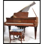 An early 20th century  mahogany cased baby grand p