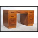 A 1930's oak twin pedestal office desk in the mann