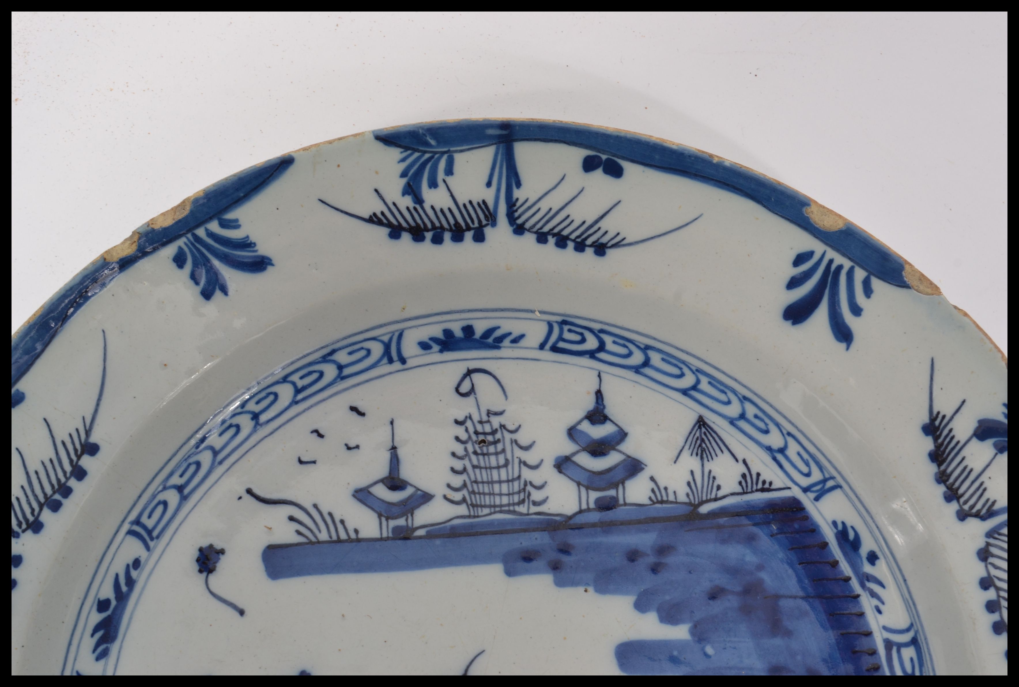 A mid 18th century English Delft pottery plate hav - Image 3 of 8