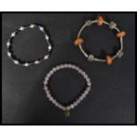 A group of three vintage bracelets to include a si