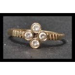 A hallmarked 9ct gold and white stone ring having