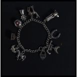 A hallmarked 925 silver charm bracelet having char