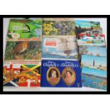 A collection of vintage tea cards in albums and loose along with cigarette cards and a quantity of