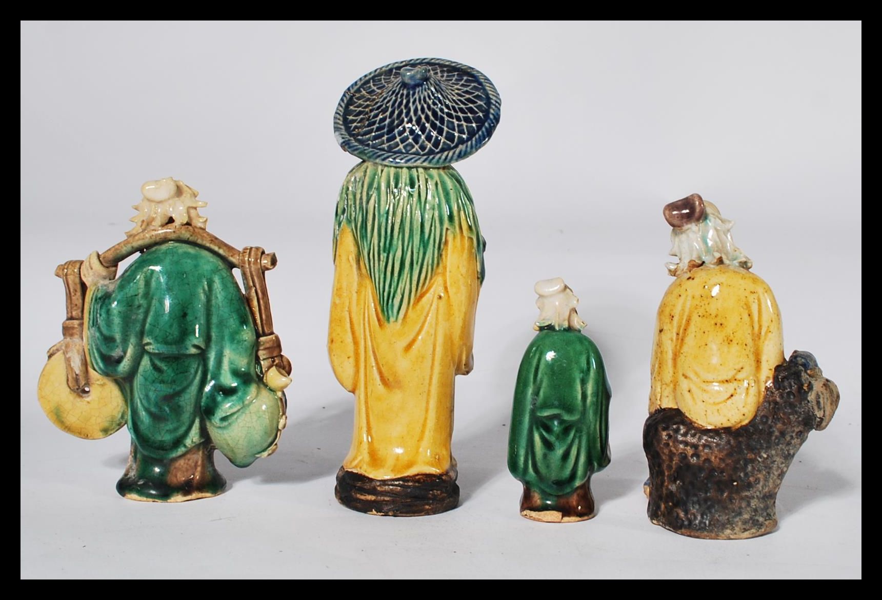 A group of four early 20th century Chinese pottery Mudman / Mudmen each in varying poses. Highest - Image 3 of 6