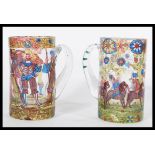 A pair of 20th century German glass tankards steins having hand painted decoration depicting court