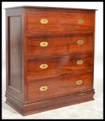 A 20th Century hardwood inlaid brass detail bow front campaign style chest of drawers, four