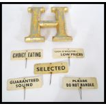 A set of vintage early 20th century food labels on ivorine plaques with sticks reading Selected