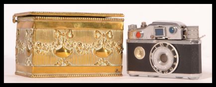 A vintage 20th Century novelty lighter modelled as a camera by KKW together with a late 19th Century