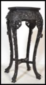 A 19th century Chinese carved hardwood plant stand - jardiniere. Of upright form  with circular