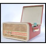 A fabulous mid Century two tone four speed portable record player by Phillips, speaker and dials