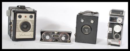 A group of vintage cameras to include a Bolex super 8 , Brownie and a Coronet along with a pair of
