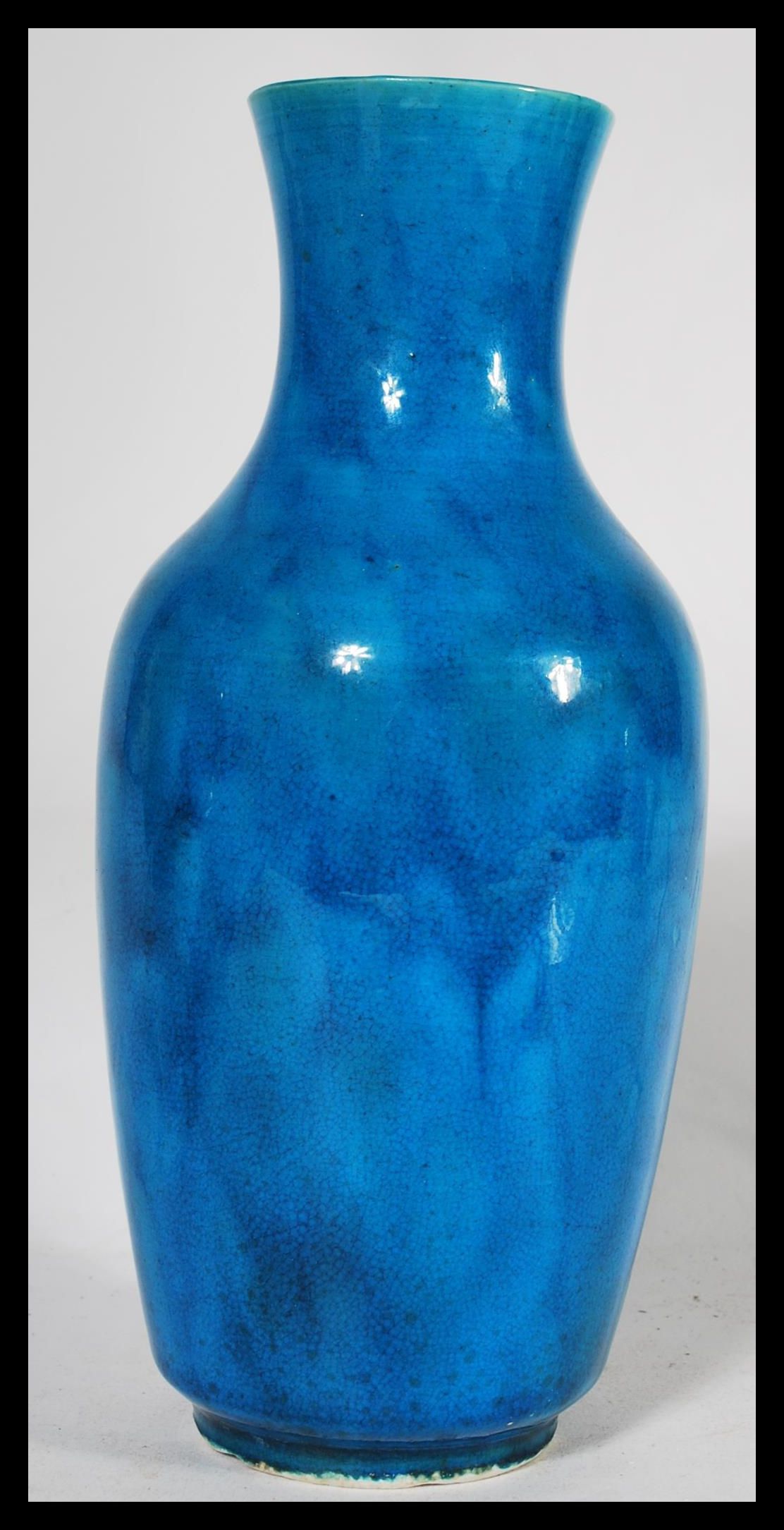 A 19th century Chinese monochrome bottle vase, glazed in merging tones of vibrant blue, elongated - Image 2 of 6