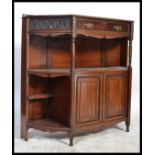 An Edwardian mahogany chiffonier bookcase base being raised on turned legs having open shelves