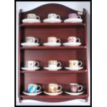 A collection of twelve Coalport ' Historic Coffee Cup Collection ' cabinet cups and saucers, each