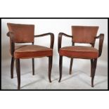 A pair of original 1930's French Art Deco bridge chairs / armchairs. Raised on saber tapered