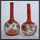 A pair of 19th century Japanese Satsuma vases of baluster form having bulbous globular decoration