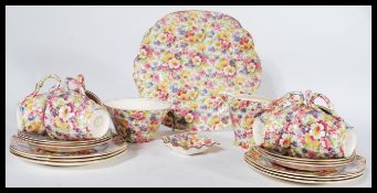 A fabulous James Kent Du Barry pattery chintz pattern part tea service comprising cups, saucers,