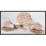 A fabulous James Kent Du Barry pattery chintz pattern part tea service comprising cups, saucers,