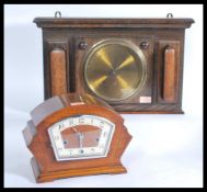 A 1920's oak wall barometer with circular dial set on oak square backing together with a 1930's