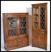 A Jaycee / Old Charm style oak china - bookcase display cabinet having leaded glass doors with