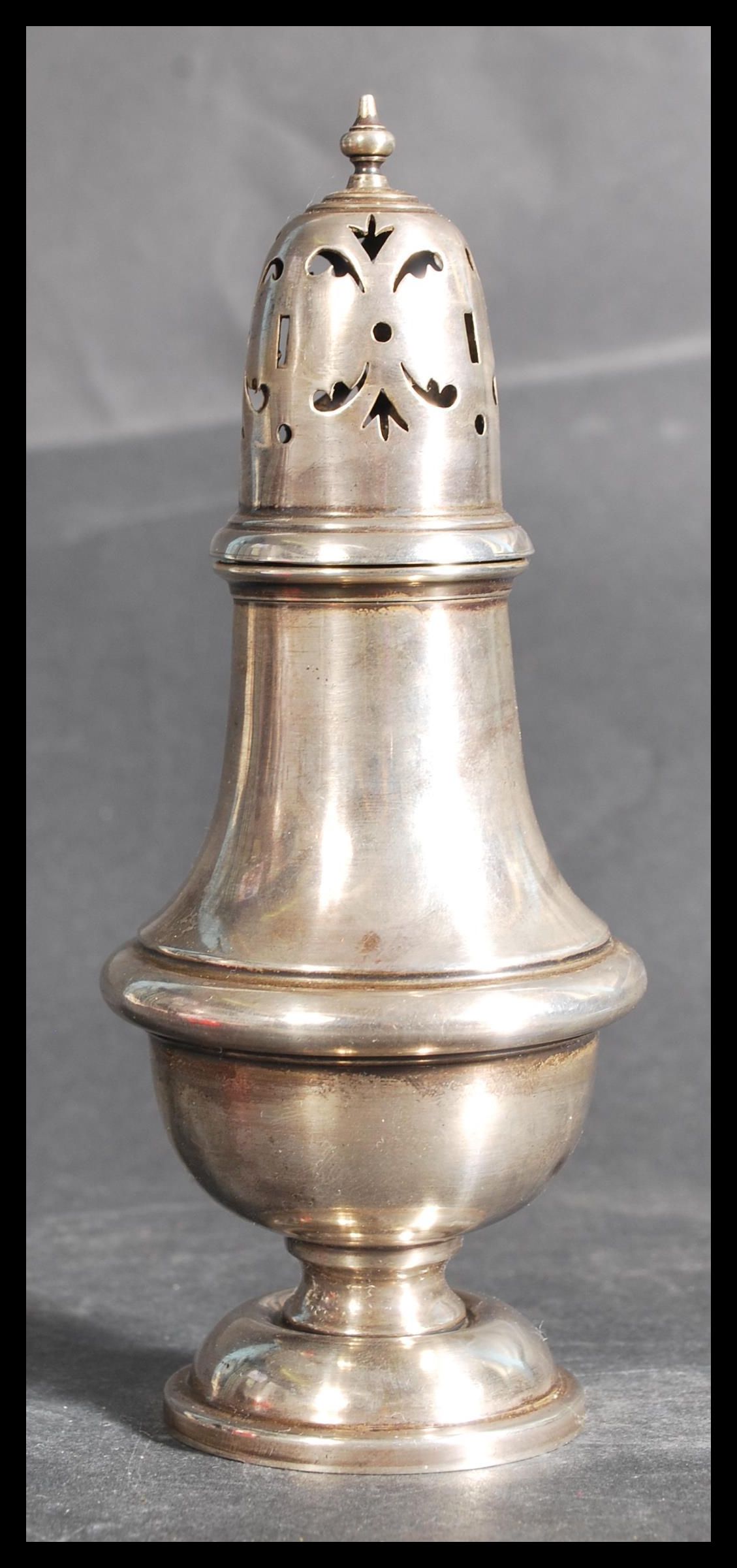 An early 20th century silver hallmarked sugar sifter of lighthouse form by S Blanckensee & Sons Ltd,