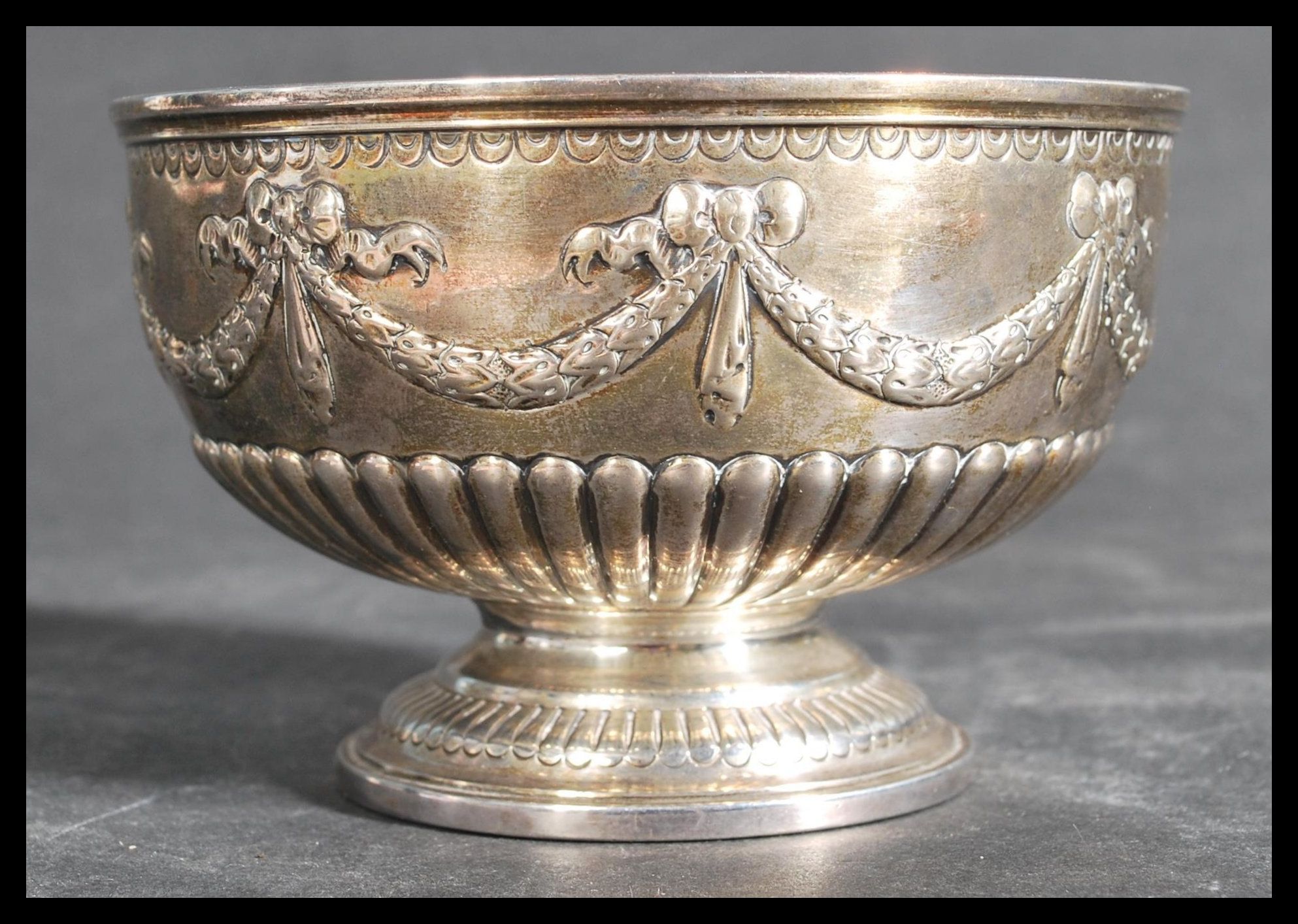 A 19th century silver hallmarked footed bowl by John Aldwinckle & Thomas Slater raised on a