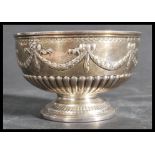 A 19th century silver hallmarked footed bowl by John Aldwinckle & Thomas Slater raised on a