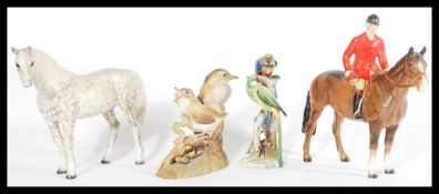 A collection of 20th Century ceramic figures to include Beswick horses, a Crown Derby Thrush and a