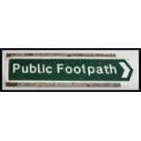 A 20th Century metal direction sign, on green ground with white lettering reading Public Footpath.