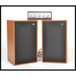 A vintage pair of Wharfdale dovedale 3 speakers in a teak wood finish, together with a Leak ' stereo