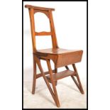 A Victorian 19th century oak metamorphic library chair - steps. The golden oak chair with fold