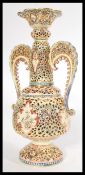 A 19th century Hungarian Fischer Budapest twin handled reticulated vase in the manner of Zsolnay