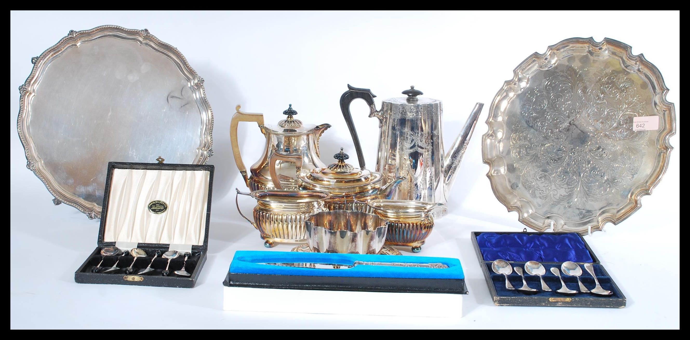 A collection of silver plated items to include salver trays, coffee pot, tea service, presentation